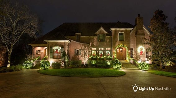 holiday lighting with garland and wreaths