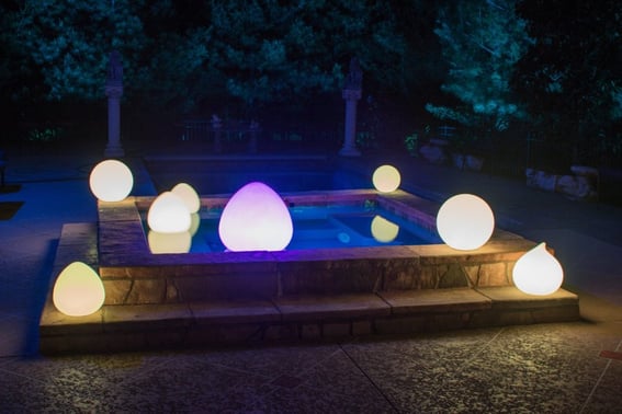 LED glow balls in teardrop floating in pool