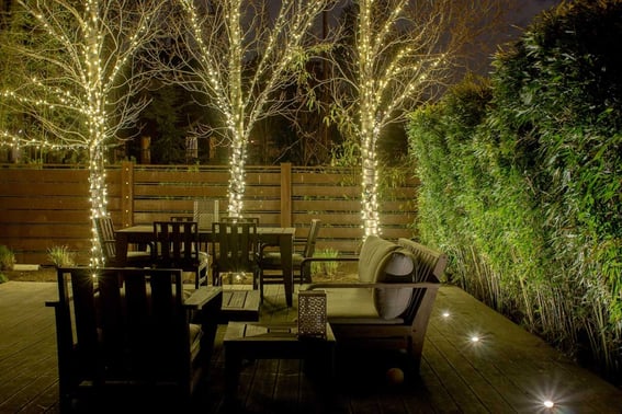 intimate deck lighting and permanent decorative string lights